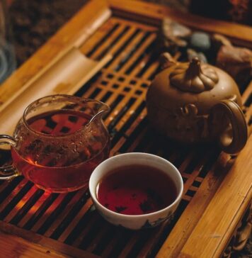 Top Winter Teas to Buy Online for Christmas selective focus photography of cup of bowl beside brown teapot
