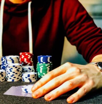 Selecting the Best Poker Table: How to Pick the Most Profitable One A man sitting at a table with a wide array of colorful chips
