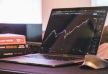 Stock Market Brokers: Essential Services for New and Seasoned Investors black and silver laptop computer