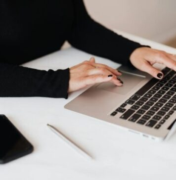 Krikya Bangladesh – A Trusted Name Crop faceless woman working on netbook in office