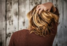 How Collagen Can Help Combat Seasonal Hair Shedding? woman near wall