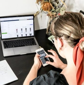 How Headless CMS Powers International Ecommerce Expansion woman in orange shirt using iphone