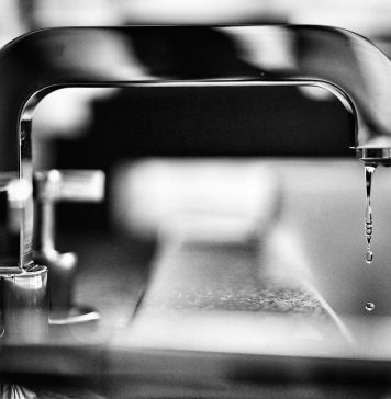 Why Is My Water Bill Suddenly So High? A Perth Homeowner’s Guide to Hidden Leaks grayscale photography of faucet